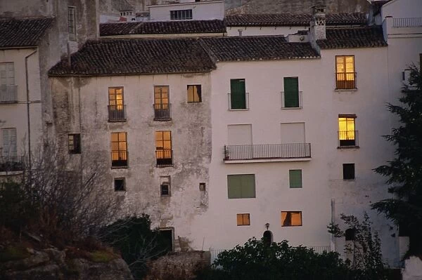 Houses in La Ciudad, old Moorish quarter, lit up by the sunset, Ronda, Andalucia