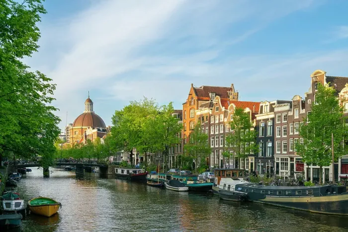 Framed Print : Houses by Singel canal and Renaissance dome of Koepelkerk Church in the background at sunset, Amsterdam, The Netherlands, Europe Framed Print : Houses by Singel canal and Renaissance dome of Koepelkerk Church in the background at sunset, Amsterdam, The Netherlands, Europe