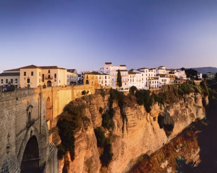 Framed Print : Houses on the Tajo edge and the bridge Puente Nuevo, old town of Ronda at sunset, Province Malaga, Andalusia, Spain, Europe Framed Print : Houses on the Tajo edge and the bridge Puente Nuevo, old town of Ronda at sunset, Province Malaga, Andalusia, Spain, Europe