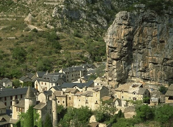 Houses in the village of La Malene below rock cliffs in the Tarn Gorges in the Midi-Pyrenees