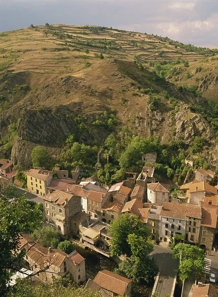 Houses of the village of St. Floret in the Couze de Pavin Valley, with hill behind