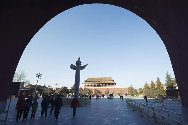 a Huabiao statue under an arch of the Gate of Heavenly Peace between the Forbidden City and Tiananmen Square Beijing China