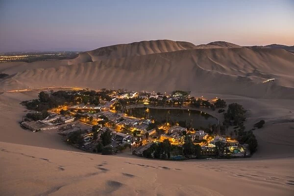 Huacachina, surrounded by sand dunes at night, Ica Region, Peru, South America