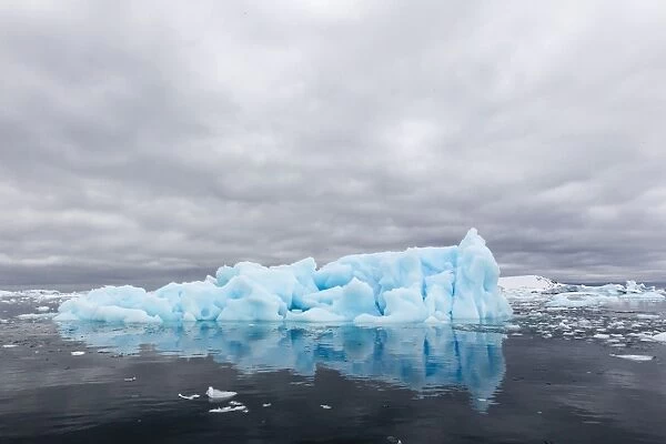 Huge blue iceberg near Petermann Island, western side of the Antarctic Peninsula, Southern Ocean, Polar Regions