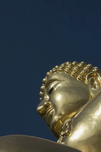 Huge golden Buddha on the banks of the Mekong River at Sop Ruak, Thailand
