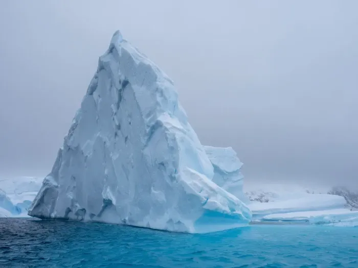 Framed Print : A huge iceberg grounded on a reef near the Iceberg Graveyard, Petermann Island, Antarctica, Polar Regions