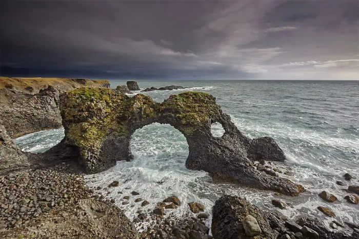 Framed Print : A huge lava arch, pounded by Atlantic surf, at Arnastapi, in Snaefellsjokull National Park, on the Snaefellsnes peninsula, west coast of Iceland, Polar Regions