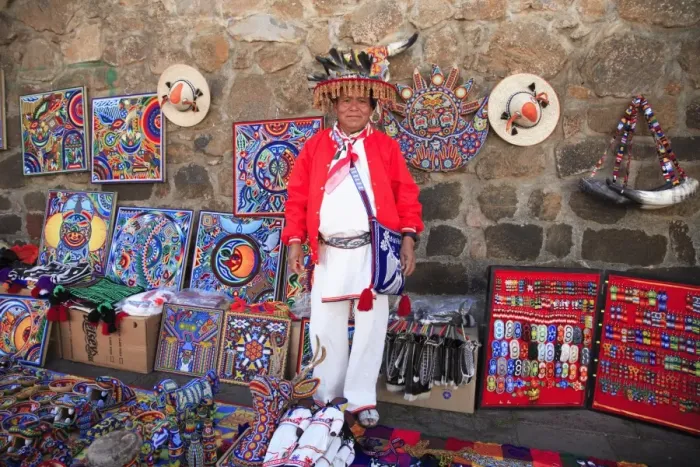 Framed Print : Huichol man selling Huichol handicrafts in the market, Patzcuaro, Michoacan state Framed Print : Huichol man selling Huichol handicrafts in the market, Patzcuaro, Michoacan state