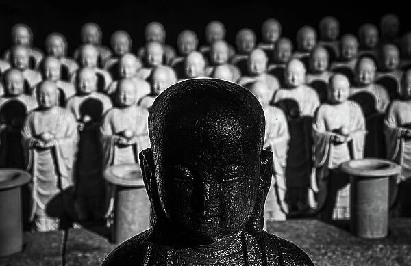 Hundreds of jizo statues lined up at the Hasedera Temple, Kamakura, Honshu, Japan, Asia