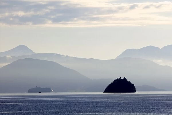 A Hurtigruten cruise boat in the fjords of Norway, Scandinavia, Europe