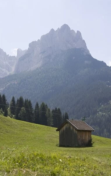 Hut with mountains beyond