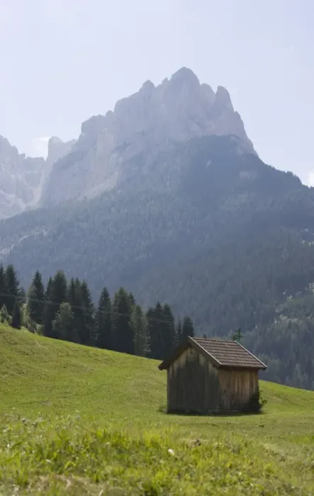 Framed Print : Hut with mountains beyond Framed Print : Hut with mountains beyond