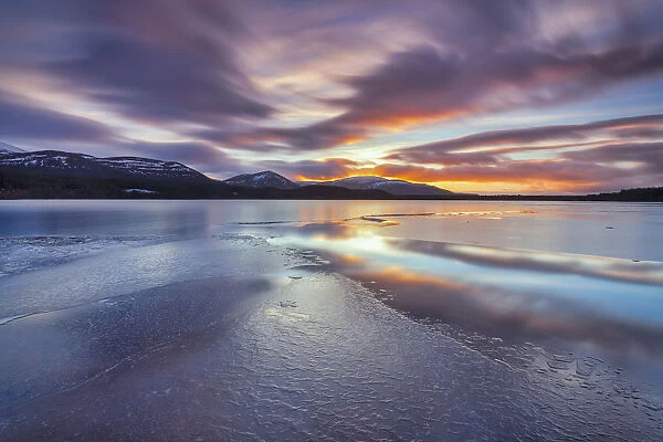Ice sheets and sunset at Loch Morlich, Glenmore, Scotland, UK