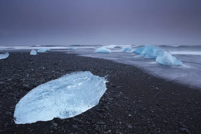 Framed Print : Iceberg washed ashore on Breidamerkursandur black sands, near Jokulsarlon glacial lagoon