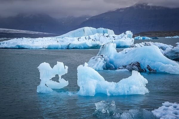 Icebergs floating in the Glacier Lagoon beneath Breidamerkurjokull glacier, Jokulsarlon