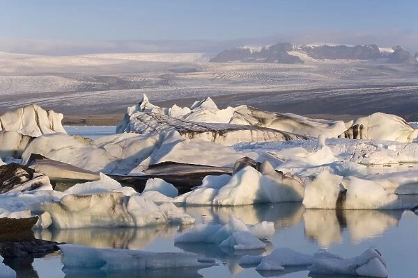 Icebergs floating in the Lagoon beneath Breidamerkurjokull Glacier