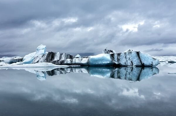 Icebergs and reflections on Jokulsarlon glacial lagoon, South Iceland, Polar Regions