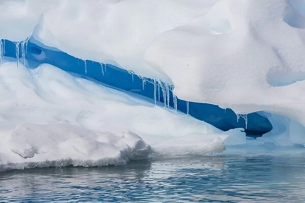 Icicles hanging from iceberg on Booth Island, western side of the Antarctic Peninsula, Southern Ocean, Polar Regions