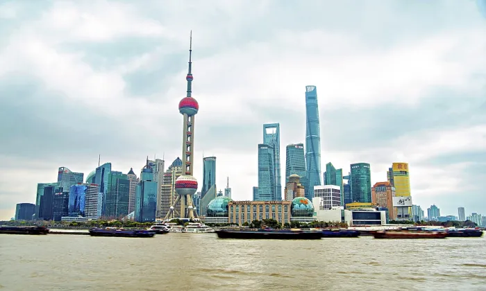 Framed Print : The iconic skyline of Lujiazui along the busy Huangpu River with never ending convoy of cargo vessels, Shanghai, China