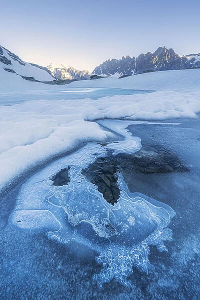 Icy surface of Forbici Lake due to spring thaw, Valmalenco, Valtellina, Sondrio province