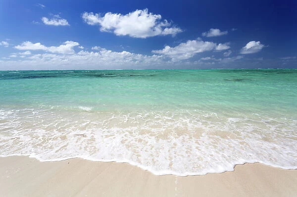 Idyllic beach scene with blue sky, aquamarine sea and soft sand, Ile Aux Cerfs, Mauritius, Indian Ocean, Africa