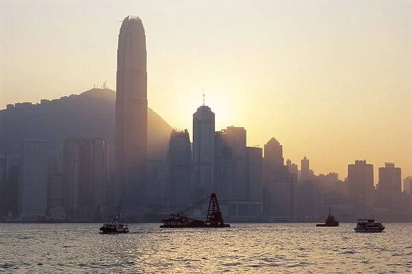 Two IFC Building and Hong Kong Island skyline across Victoria Harbour at dusk