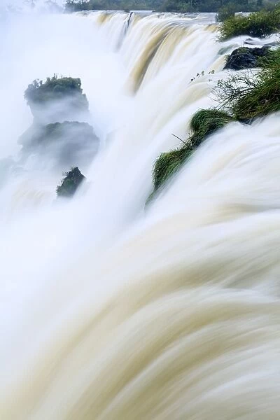 Iguacu (Iguazu) (Iguassu) falls in full flow, UNESCO World Heritage Site, Argentina