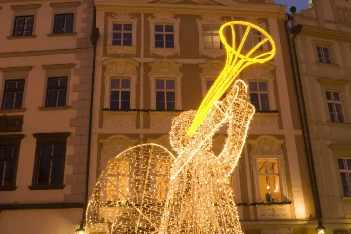 Framed Print : Illuminated angel against Baroque house facades, part of Christmas decorations Framed Print : Illuminated angel against Baroque house facades, part of Christmas decorations