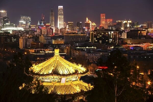 Illuminated pagoda and Beijing cityscape at night, Beijing, China, Asia