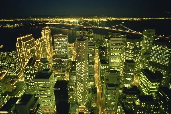 Illuminated skyscrapers and Bay Bridge, San Francisco, California, United States of America
