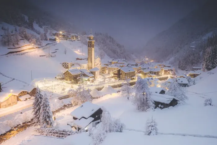 Framed Print : Illuminated village of Gerola Alta and frozen river covered with snow during winter dusk Framed Print : Illuminated village of Gerola Alta and frozen river covered with snow during winter dusk