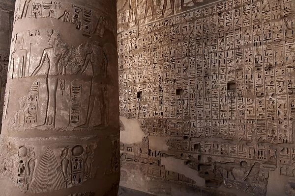 Images and hieroglyphics adorn the walls of Medinet Habu temple complex