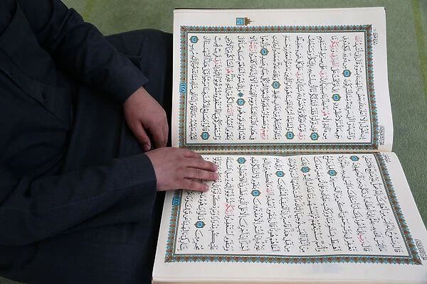 Imam reading the Quran in a mosque, Seine-e-Marne, France, Europe