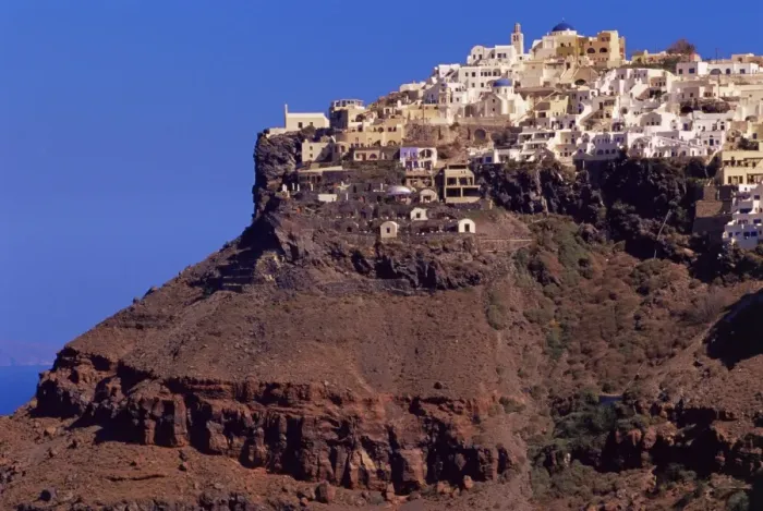 Framed Print : Imerovigli village perched on red volcanic hill Framed Print : Imerovigli village perched on red volcanic hill
