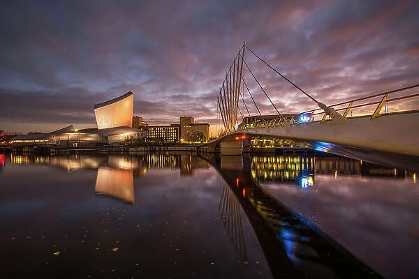 Imperial War Museum North and swingbridge reflected at night, Salford Quays, Manchester, England, United Kingdom, Europe
