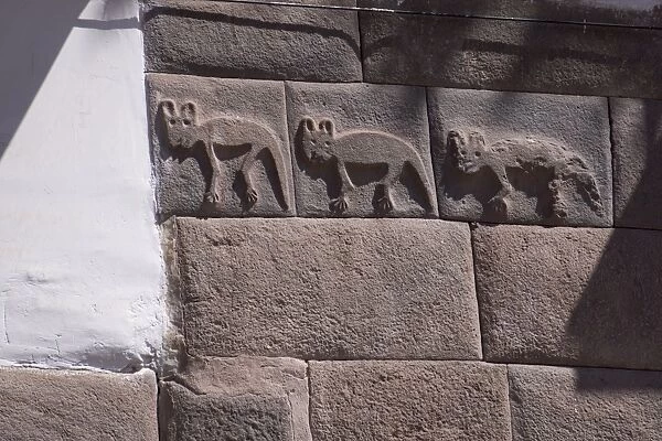 Inca carving on wall, probably foxes, centre of Cuzco, UNESCO World Heritage Site, Peru, South America