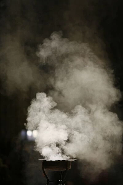 Incense burning in Paris cathedral, Paris, France, Europe
