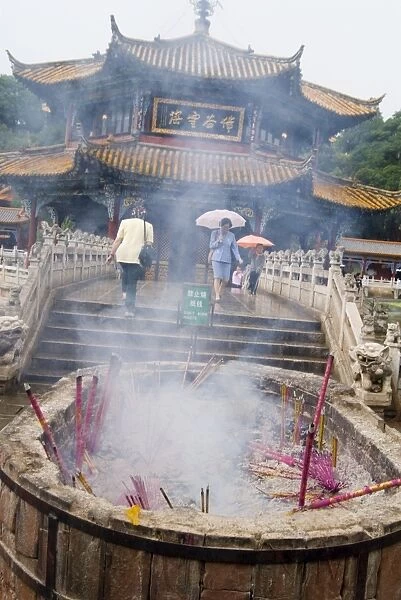 Incense sticks burning in front of Yuantong Temple, Kunming, Yunnan, China, Asia