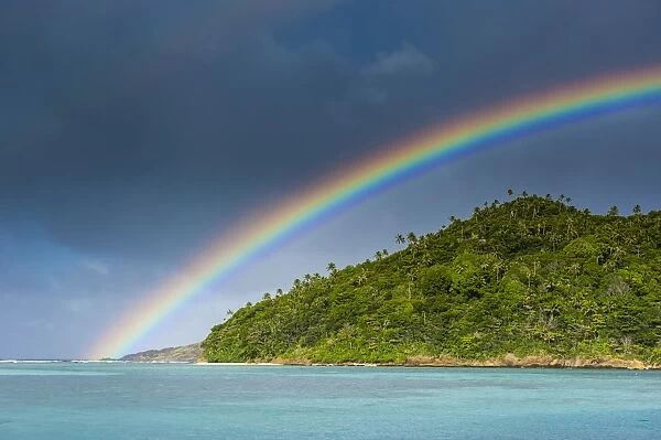 Incredble rainbow over an islet off Ofu Island, Manua Island group, American Samoa, South Pacific, Pacific