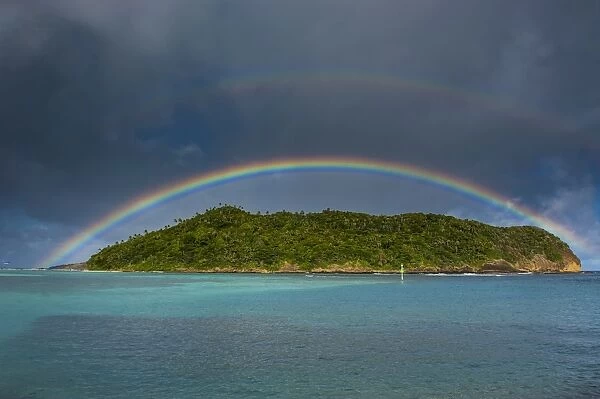 Incredible rainbow over an islet off Ofu Island, Manua Island group, American Samoa, South Pacific, Pacific
