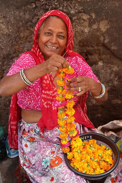 Indian woman making garlands in Ajmer, Rajasthan, India, Asia