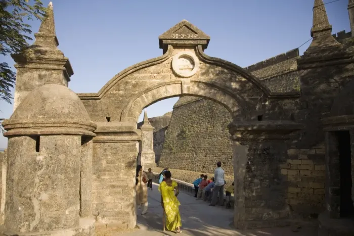 Framed Print : An Indian woman in a sari walks through the gate leading to the Fortress in Diu