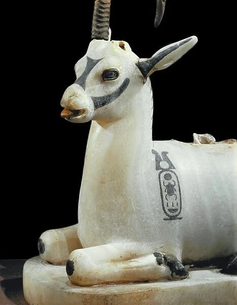 Inlaid alabaster unguent jar in the form of an ibex, with one natural horn
