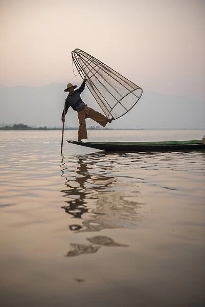 Inle Lake fisherman at sunrise (Intha fisherman), near Nyaungshwe, Shan State, Myanmar (Burma)
