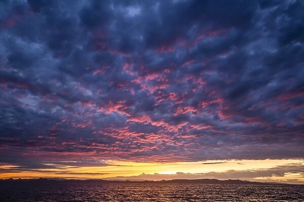 Intense clouds and sunset over Baja Peninsula from Isla Ildefonso, Baja California Sur