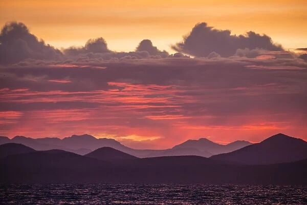 Intense clouds and sunset over Baja Peninsula from Isla Ildefonso, Baja California Sur