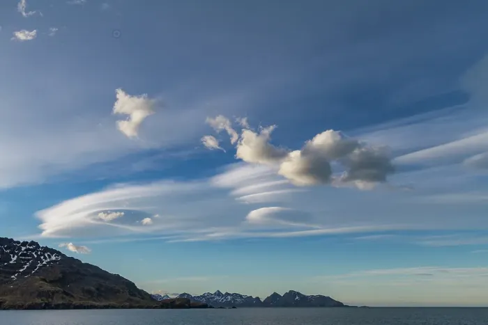 Framed Print : Interesting lenticular cloud formations forming over the island of South Georgia in the Southern Ocean Framed Print : Interesting lenticular cloud formations forming over the island of South Georgia in the Southern Ocean