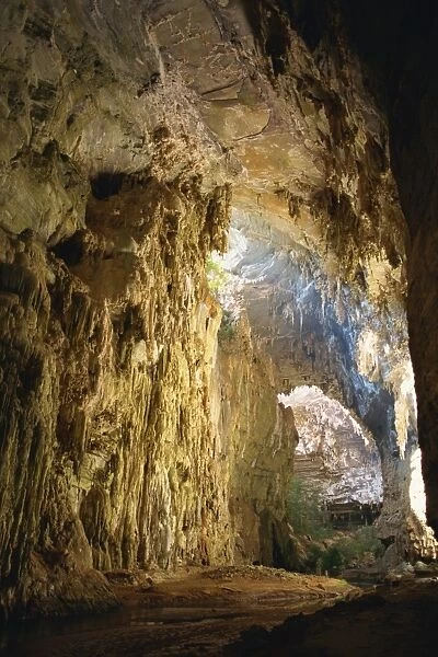 Interior of the Gruta do Janelao, a limestone cave passage 100m high, lit through roof window