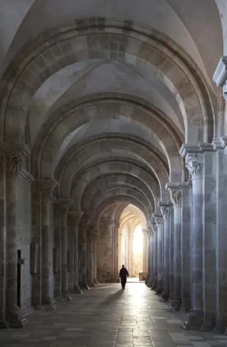 Framed Print : Interior north nave aisle with priest walking away, Vezelay Abbey, UNESCO World Heritage Site