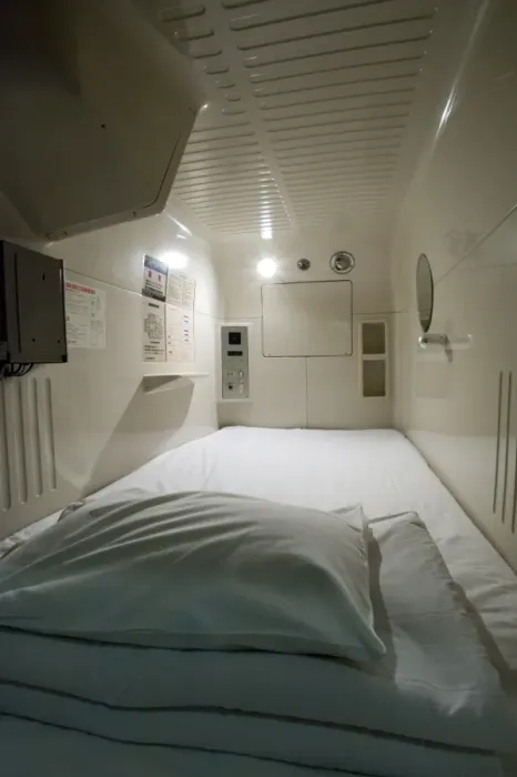 Framed Print : Interior view of single-person sleeping compartment at capsule hotel in Osaka Framed Print : Interior view of single-person sleeping compartment at capsule hotel in Osaka